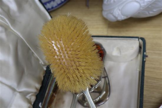 A cased plated and tortoiseshell brush set